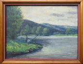 Rybář na břehu řeky